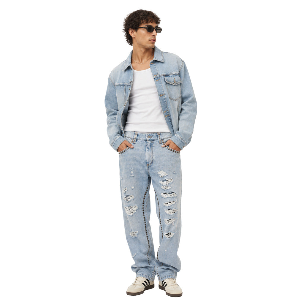 Pantalone in denim con borchie