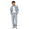 Pantalone in denim con borchie